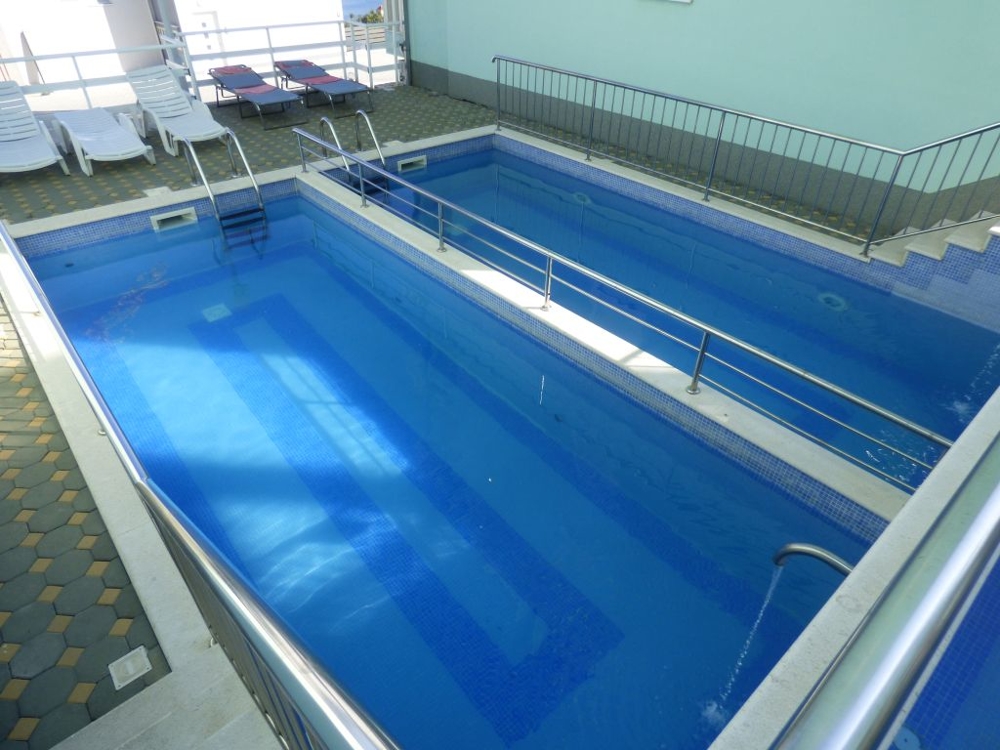 Swimming pool of the property A1430 on the island Ciovo in Dalmatia.