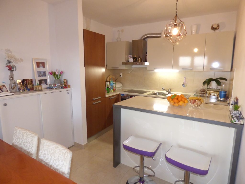 Dining area and kitchen of apartment A1493 in Croatia, island Ciovo.