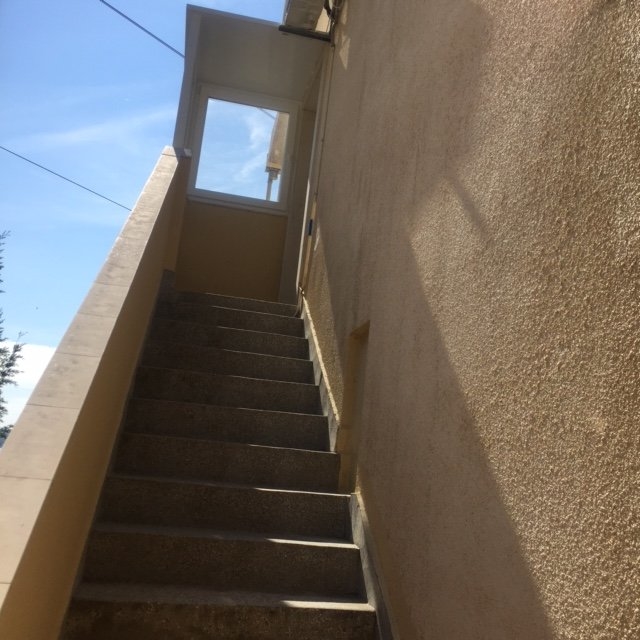 Outside stairs that lead to the apartment.