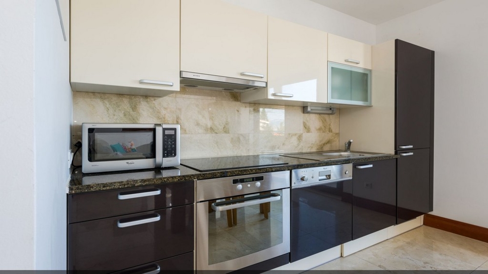 A fully equipped kitchen of the property in Central Dalmatia - Buy an apartment in Croatia.