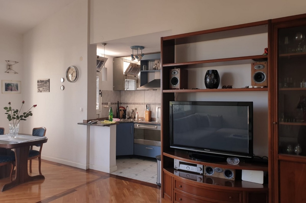 Living area and view of the kitchen of property A1711 which is for sale in Split, Croatia.