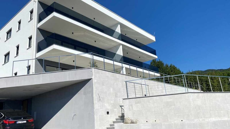 A covered balcony of the building with a view of the sea - buy an apartment in Croatia.