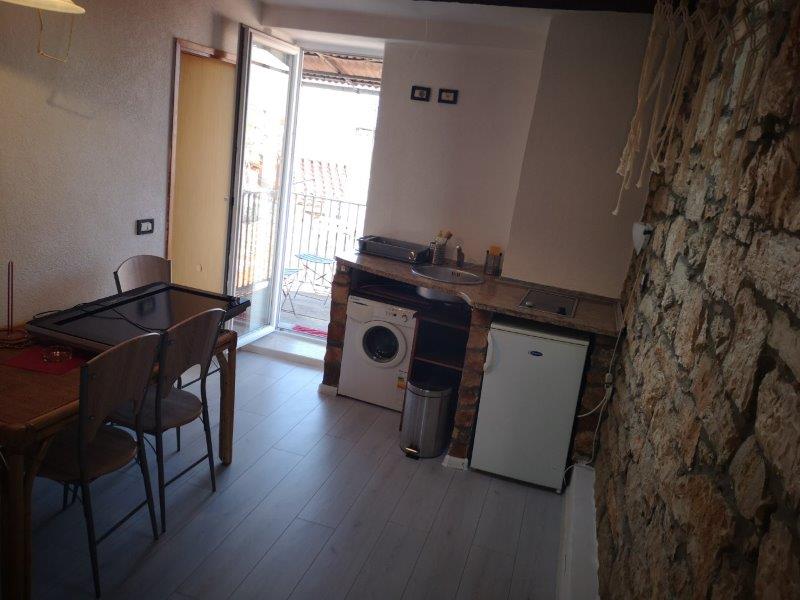 Dining area and access to the terrace of the apartment.
