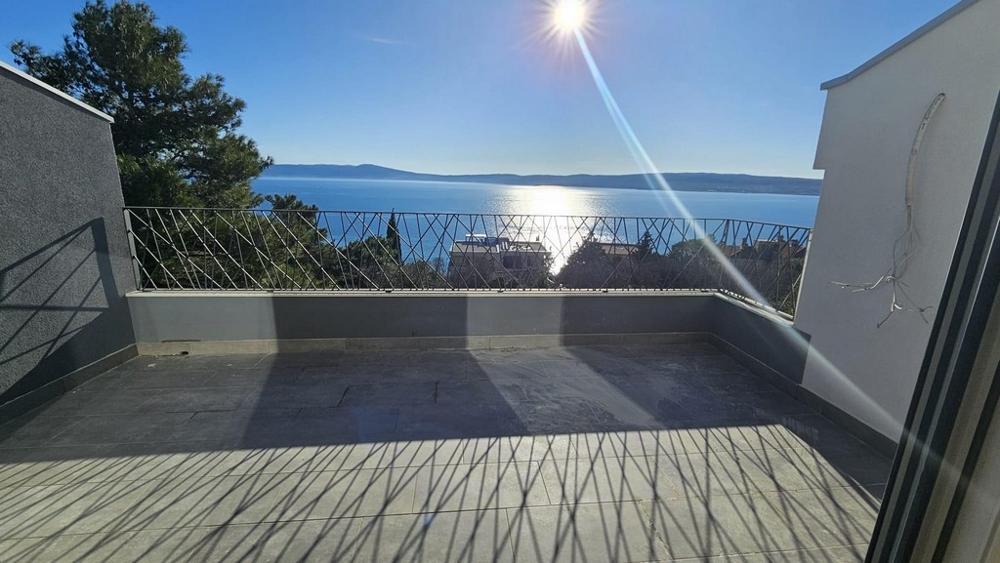 Bright terrace of a modern apartment for sale in Crikvenica with breathtaking sea views and clear blue skies
