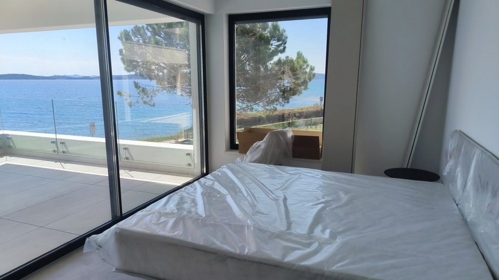 Bedroom with terrace and sea views.