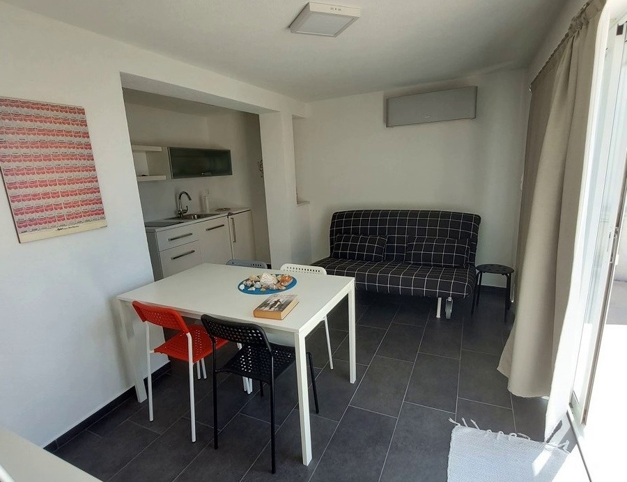 Air-conditioned studio on the lower floor of the residential building in Tisno.
