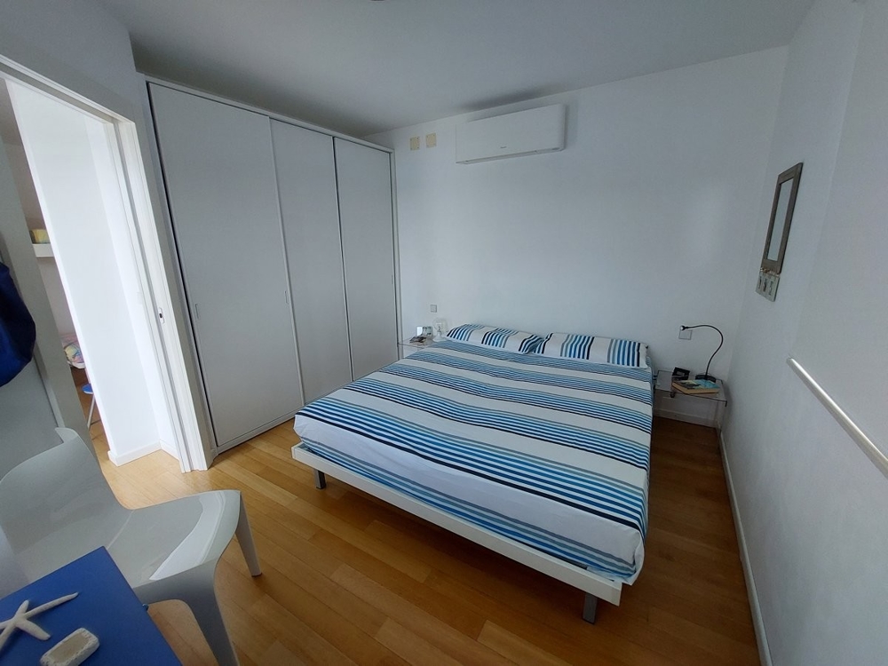 Air-conditioned bedroom with double bed.