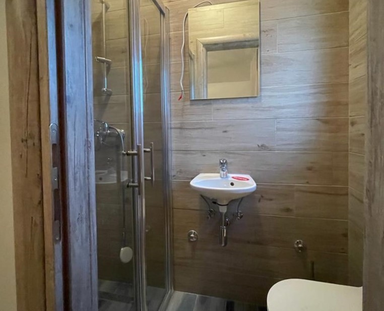 Modern bathroom with shower cabin in an apartment for sale in Croatia.