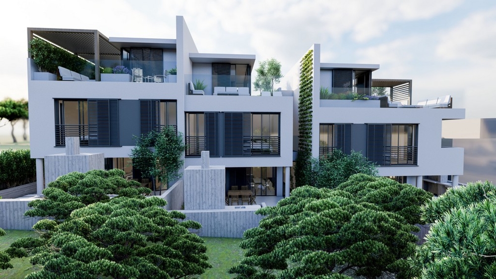 Front view of a modern property in Croatia with balconies and surrounded by trees.