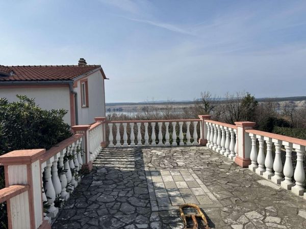Terrace with stone tiles and balustrade, nature view, apartment for sale in Tisno, Croatia