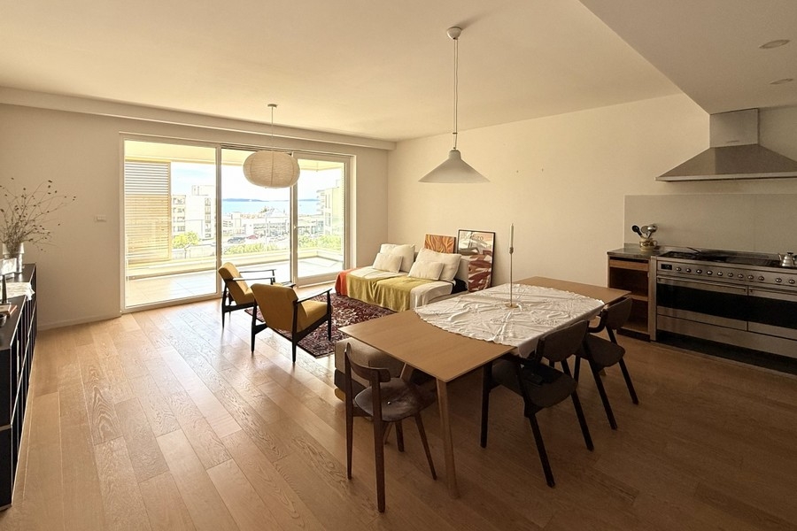 Bright living and dining area with open kitchen