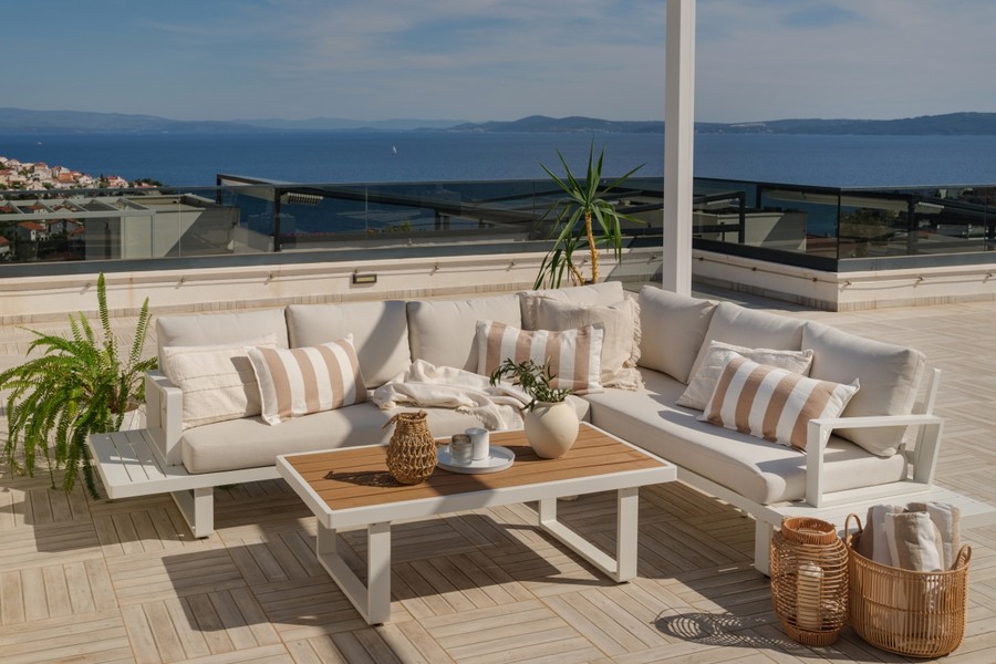 Roof terrace with seating area and sea view