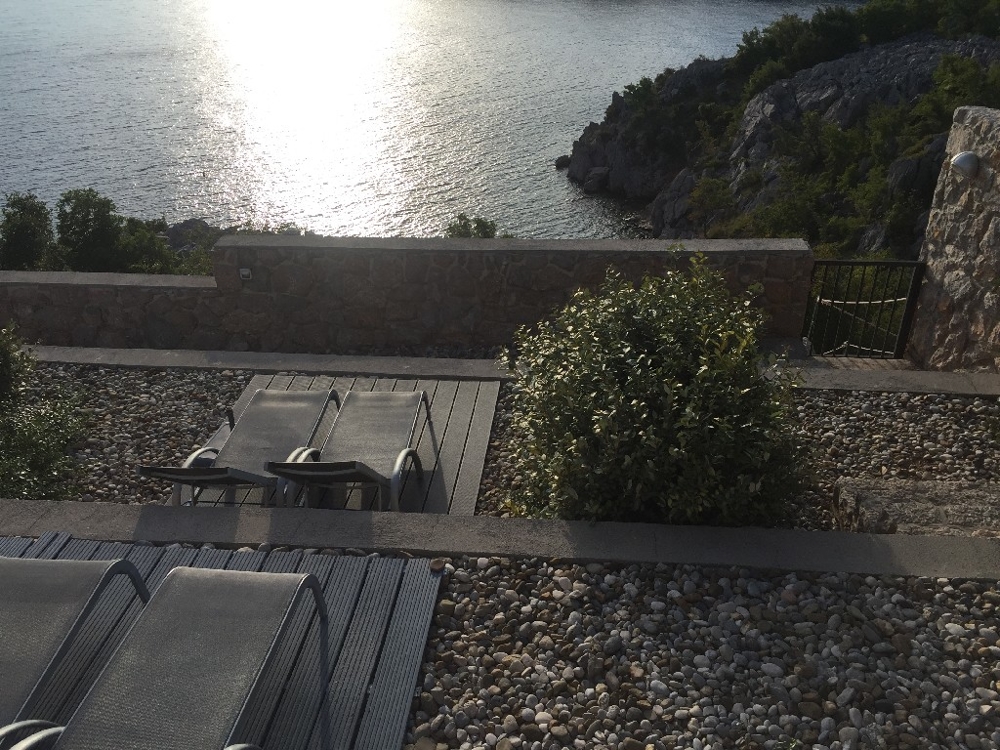 Terrace with steps down to the sea.