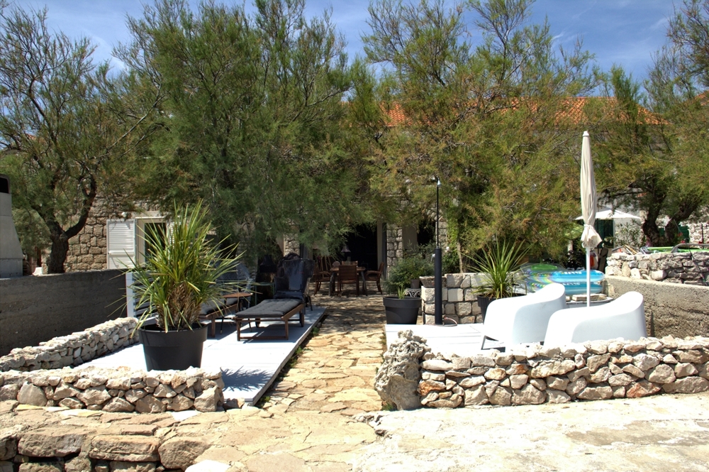 Garden of the property H1309, a house by the sea on the island of Murter in Croatia.
