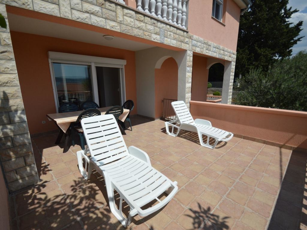 Terrace with sun loungers on the ground floor of house H1336, Zadar region.