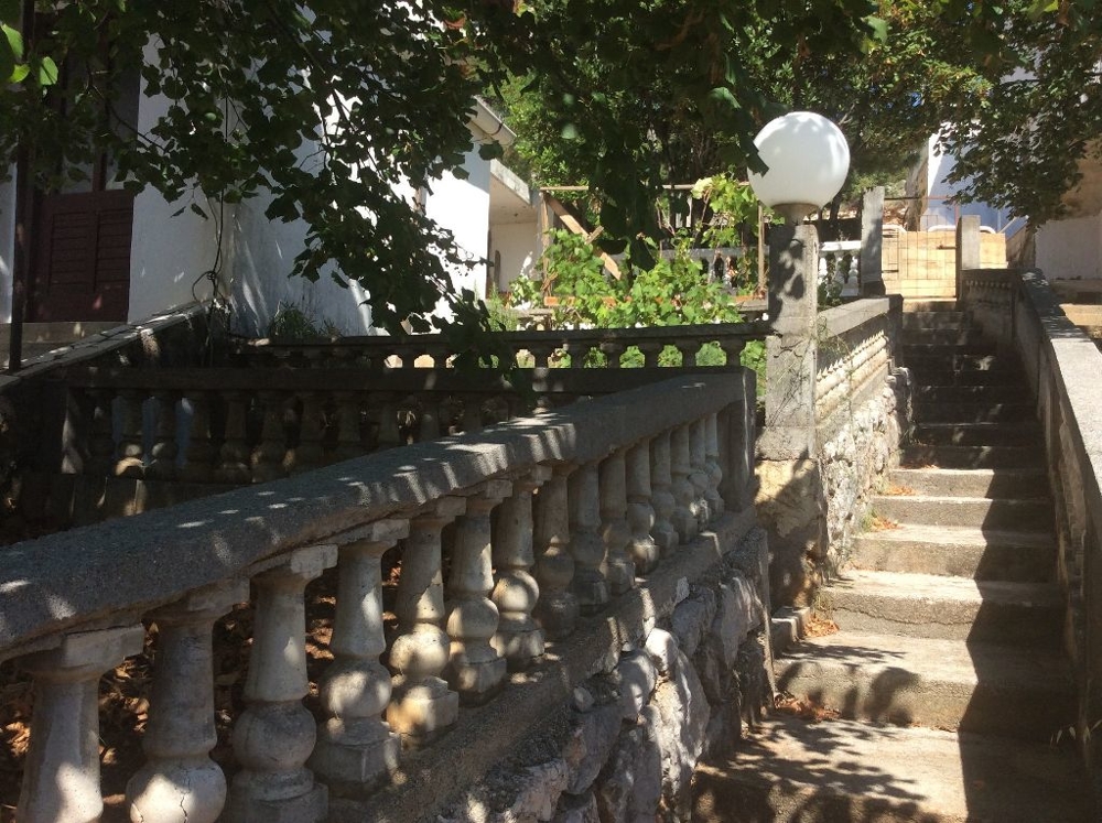 Leading stairs to the entrance of property H1392.
