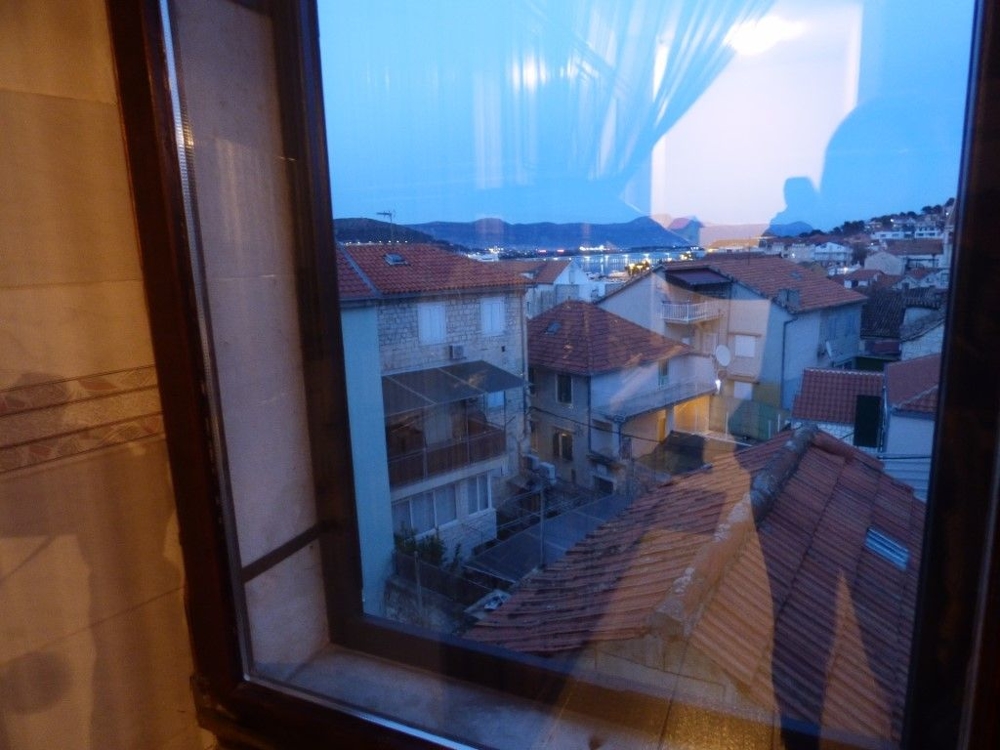 View of the city and the sea from the top floor of the house.