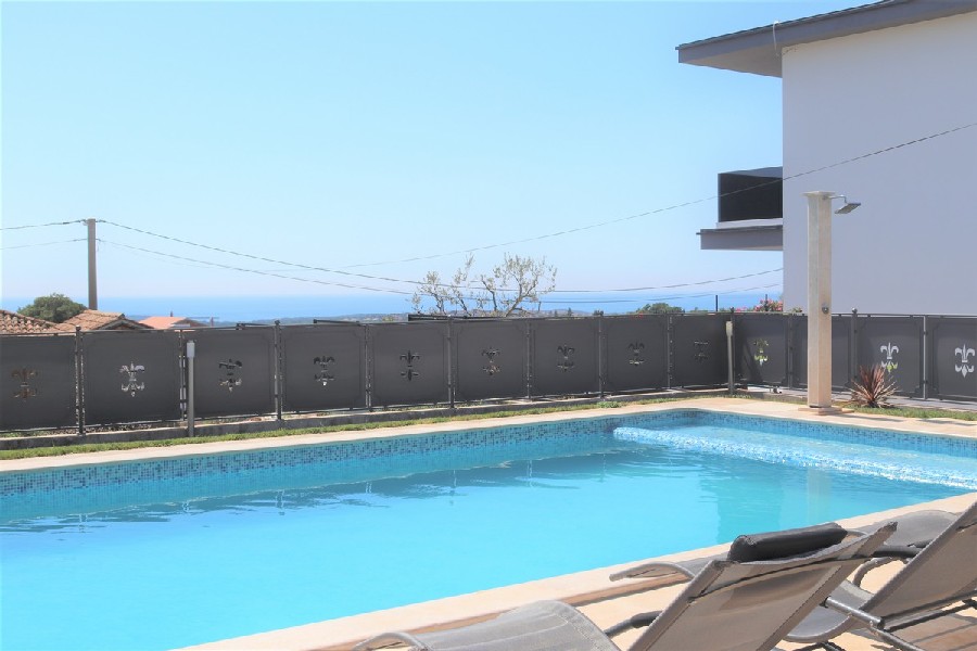 Swimming pool and sea view from the pool or sun terrace of house H1512, which is for sale in Croatia.