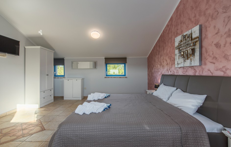 Glance into one of the five comfortable bedrooms.