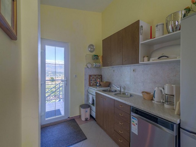 View of the kitchenette with the exit of the property.