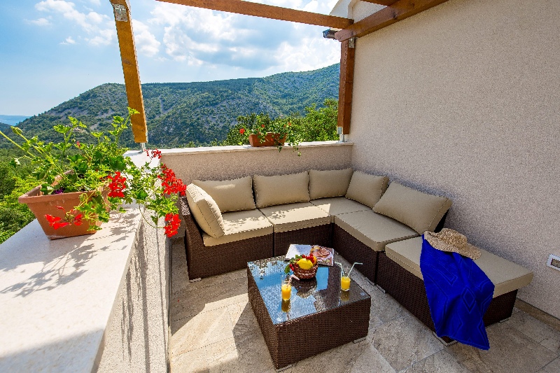 Terrace with a view of the green - house H1531 for sale near Crikvenica, Croatia.