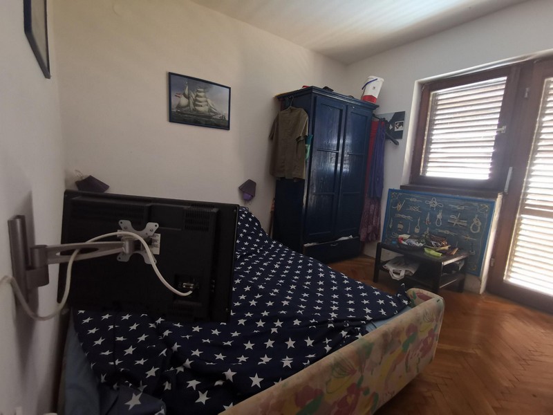 Another bedroom with double bed with the exit to the balcony on the ground floor in the Kvarner Bay.