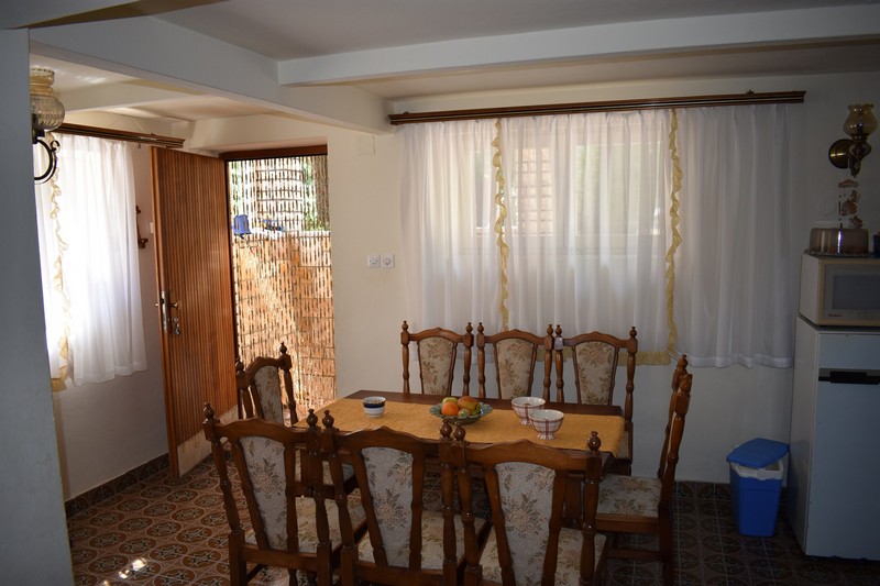 Dining area and access to the terrace on the ground floor of the property.