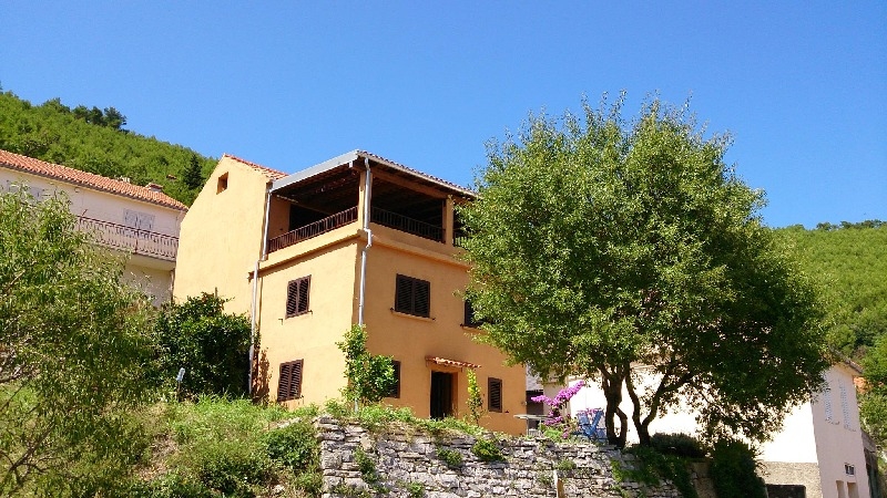 View of the rear of the house with a view of the large covered balcony - buy stone house Croatia