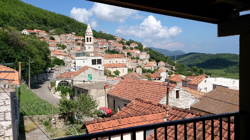 A closer look at the village from the covered balcony - buy stone house Croatia.