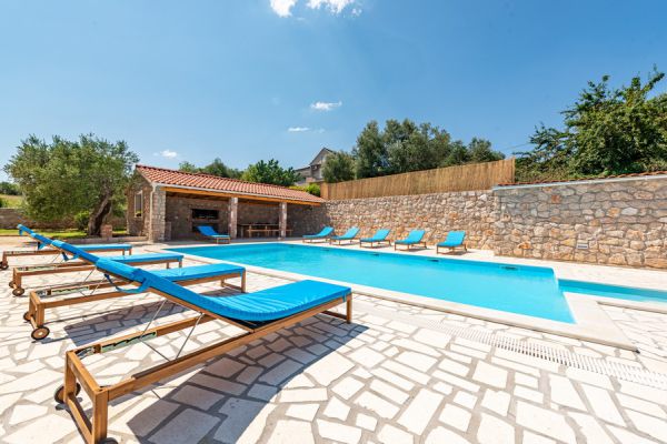 Buy a Mediterranean-style house with a large pool
