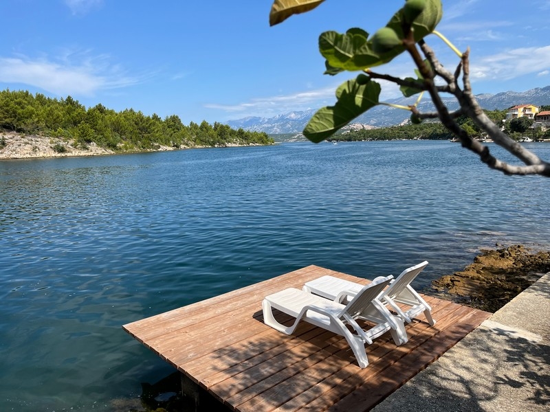 Boat dock in front of the house of property H1755 for sale in Croatia - Panorama Scouting.