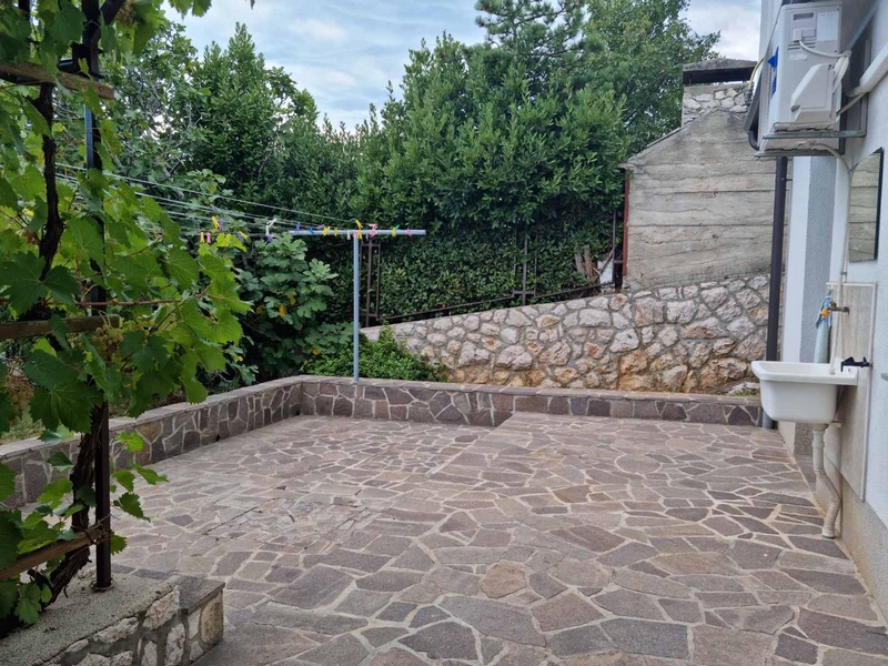Paved terrace in the outside area of ​​the house H1890, Novi Vinodolski, Croatia.