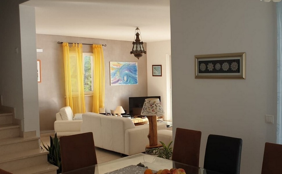 Living area with pictures on the wall.