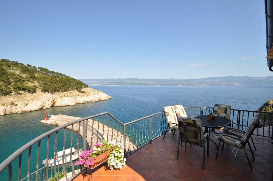 View of the sea and harbor from the terrace of property H2768 in Vrbnik, Croatia.