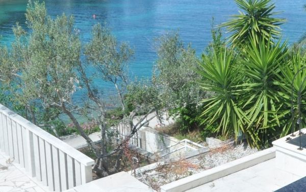 Views of the crystal clear sea from the garden of a seaside house for sale in Croatia
