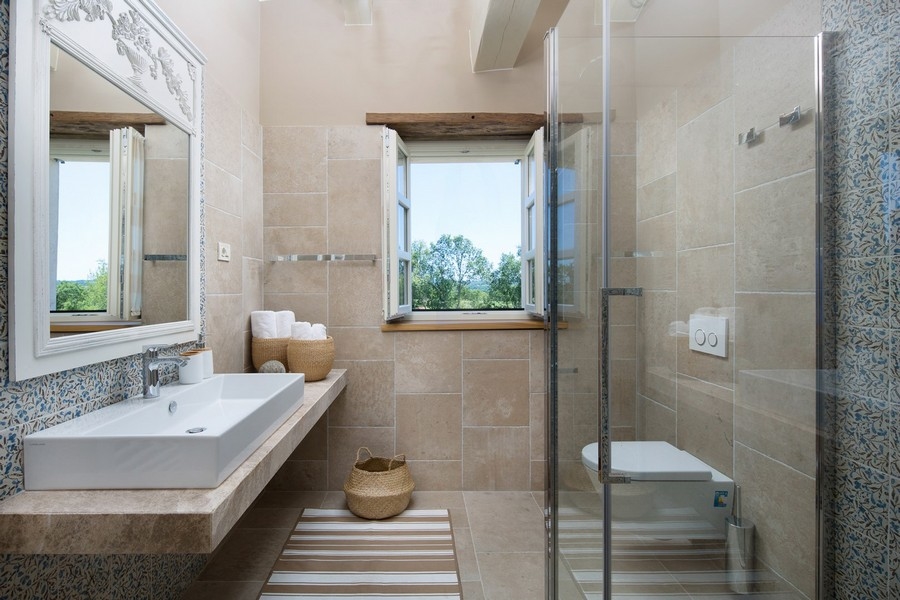 Modern bathroom with walk-in shower and elegant tiles in a luxury villa, available at Real Estate Croatia H2878