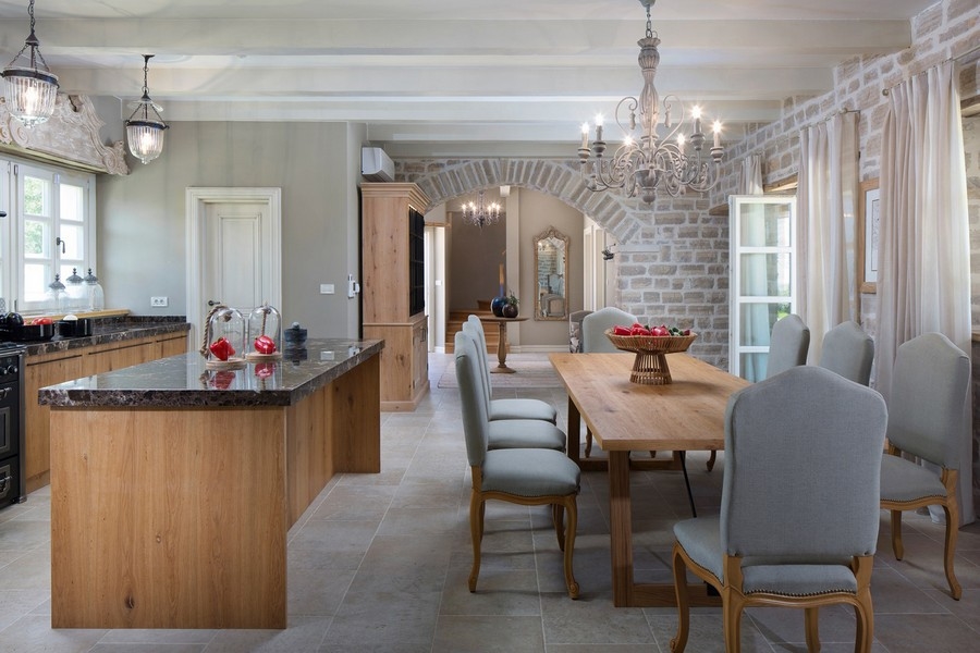 Inviting kitchen in Croatian villa with kitchen island and open dining area, classic design elements