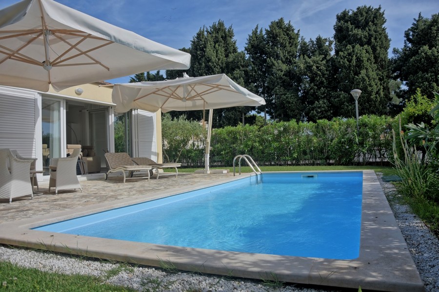 Elegant villa for sale in Istria with swimming pool and parasols