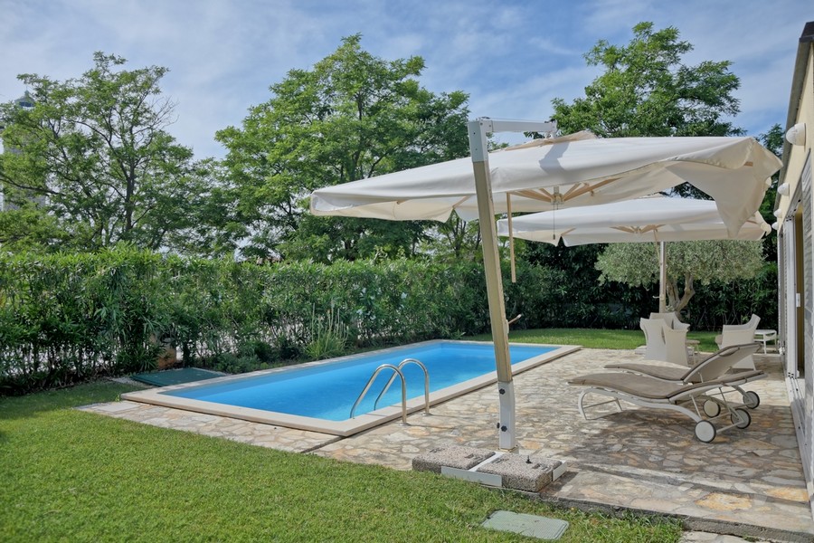 Buy a house in Istria with a private pool and views of lush greenery.