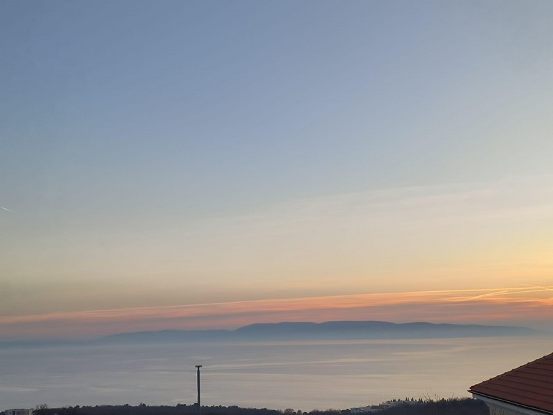Sunrise over the property in Croatia with a view of the sea and mountains in the background
