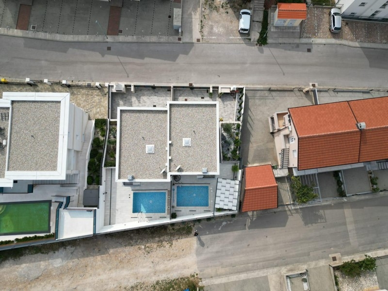Aerial view of real estate in Croatia with pools
