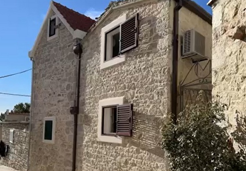 Exterior view of a traditional Dalmatian stone house in Primošten, Croatia, for sale