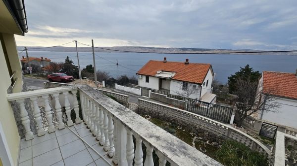 View from the upper terrace of a house for sale in Karlobag with sea views and neighboring houses
