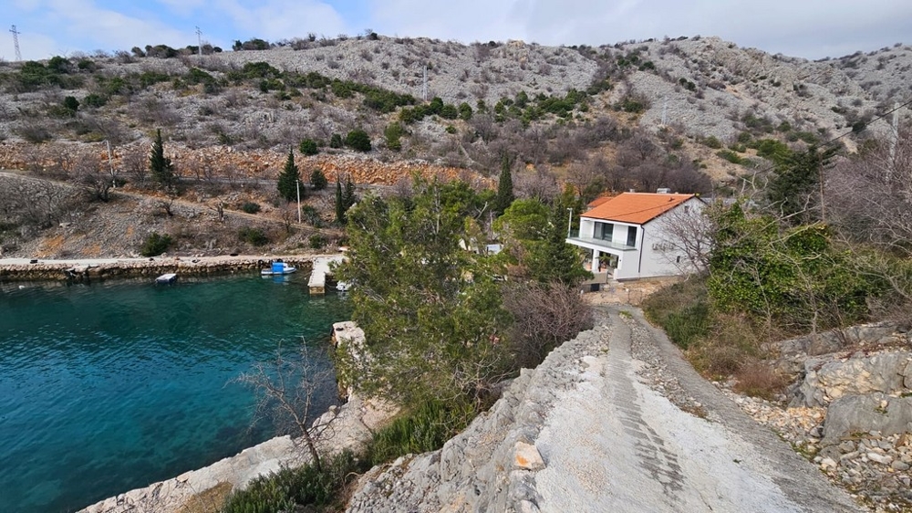 Side view of a newly built villa on the Adriatic Sea in Croatia on rocky terrain