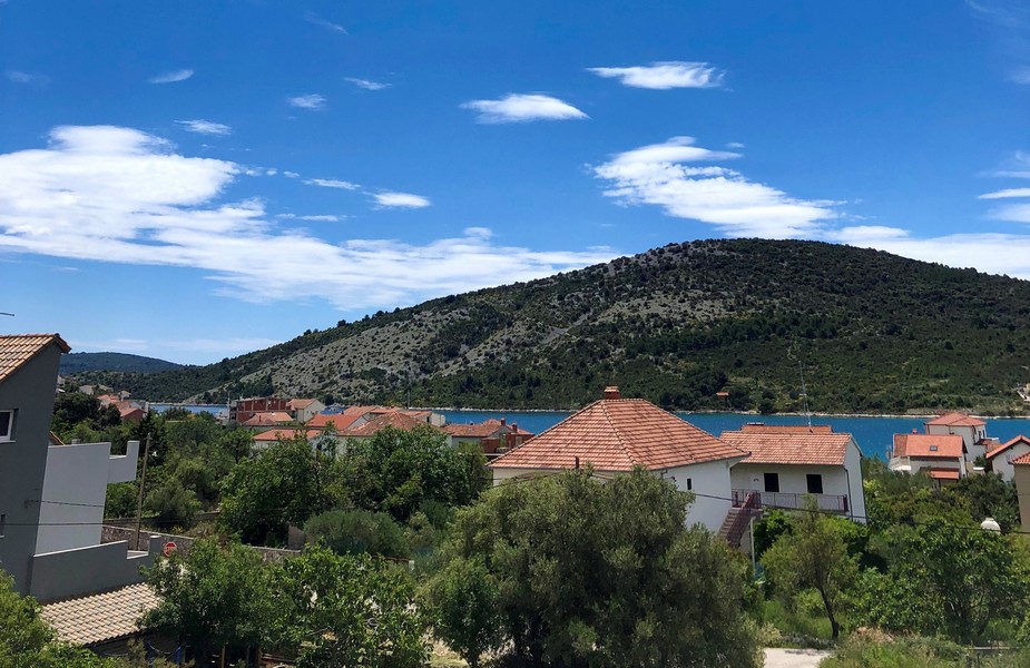 View of the Croatian coastal landscape with houses and sea in the background