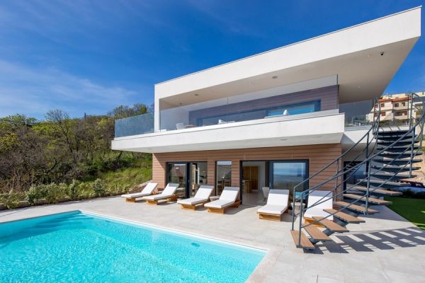 Modern villa with pool and deckchairs, real estate Croatia, buy villa on the island of Krk