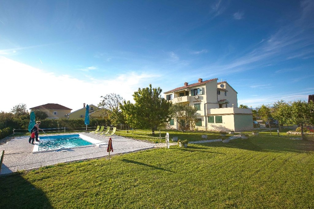 Buy apartment house with several apartments by the sea in Croatia.